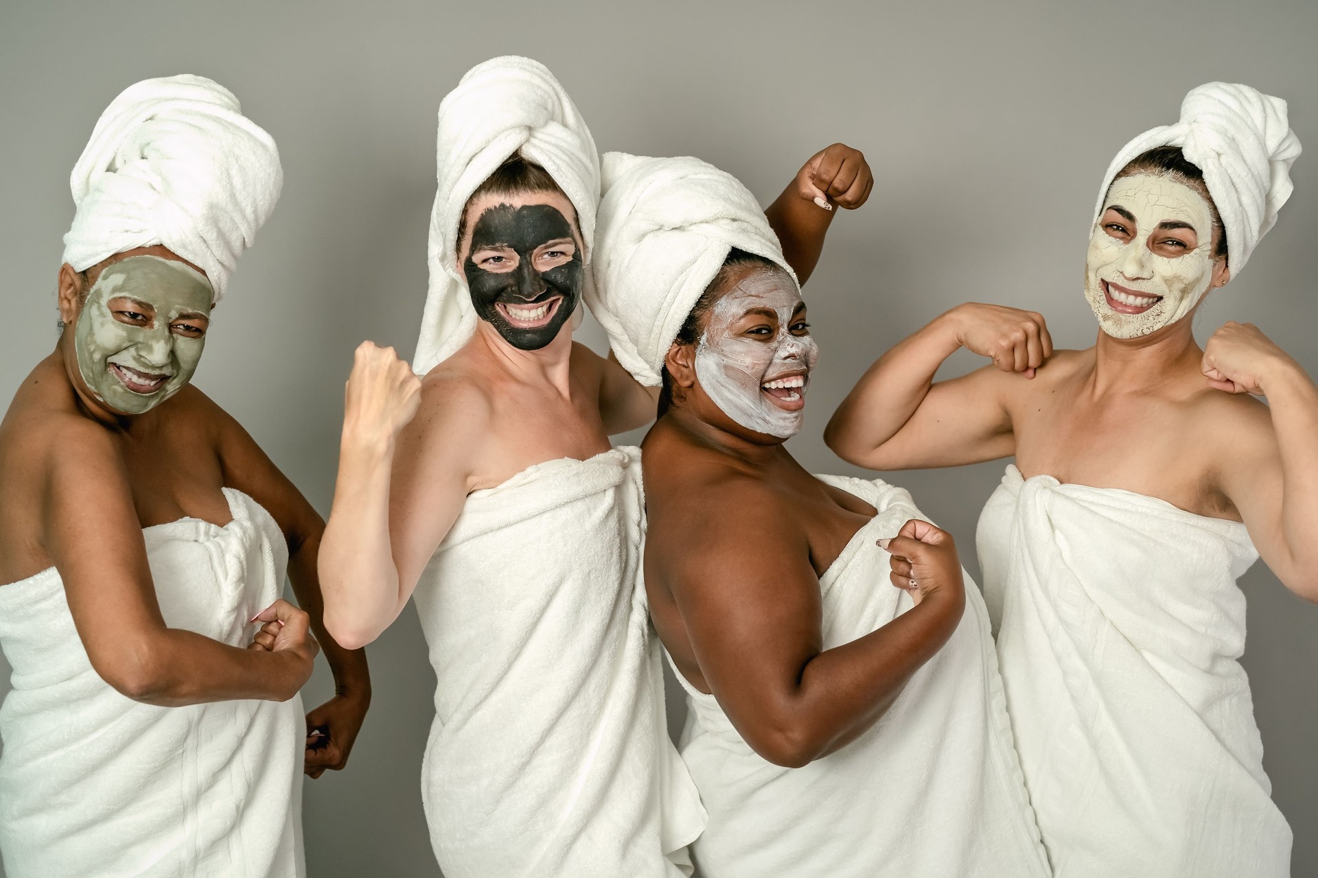 Happy multiracial females with different age and body size having skin care spa day - People selfcare concept